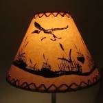 14" Rustic Flying loon scene-Faux oiled kraft lamp shade with lacing top and bottom.