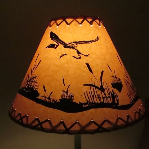 14" Rustic Flying loon scene-Faux oiled kraft lamp shade with lacing top and bottom.