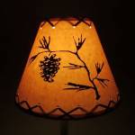 14" Rustic Pinecone scene-Faux oiled kraft lamp shade with lacing top and bottom.
